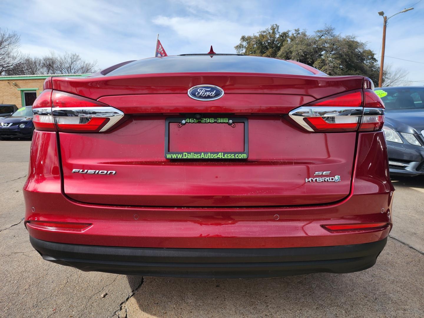 2019 RED Ford Fusion Hybrid SE (3FA6P0LU7KR) , AUTO transmission, located at 2660 S.Garland Avenue, Garland, TX, 75041, (469) 298-3118, 32.885551, -96.655602 - Welcome to DallasAutos4Less, one of the Premier BUY HERE PAY HERE Dealers in the North Dallas Area. We specialize in financing to people with NO CREDIT or BAD CREDIT. We need proof of income, proof of residence, and a ID. Come buy your new car from us today!! This is a 2019 FORD FUSION SE HYBRID - Photo#4